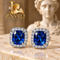 Royal Blue Cushion Halo Stud Earrings — styled view